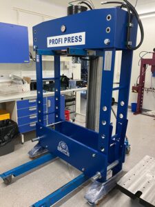 100 ton workshop press being moved into location in a laboratory In the back corner - special installation of a hydraulic press